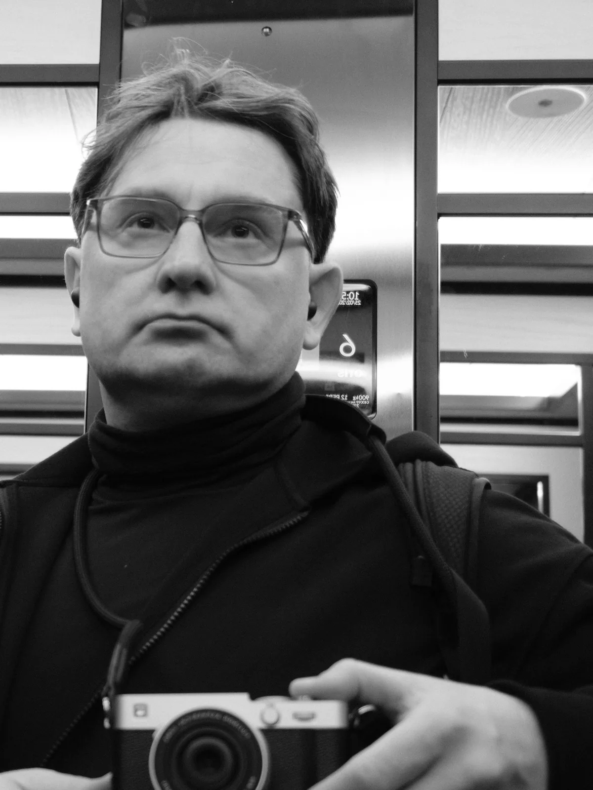Self-portrait, elevator mirror